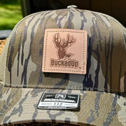 BuckedUp® Leather Patch Mossy Oak Bottomland with Green Mesh Snapback